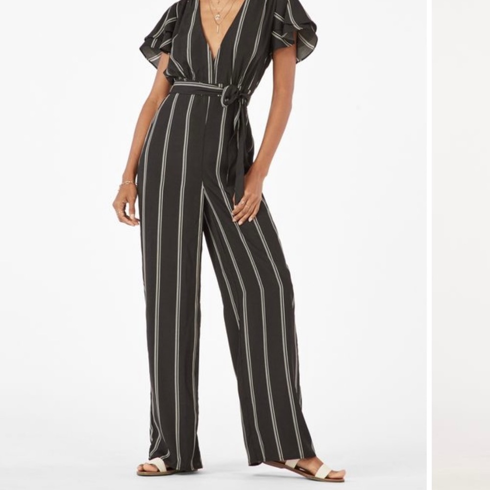 JustFab black and white flutter sleeve striped jumpsuit size M deep V wide leg